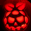 PumpkinPi Industries logo: a raspberry carved into a glowing pumpkin